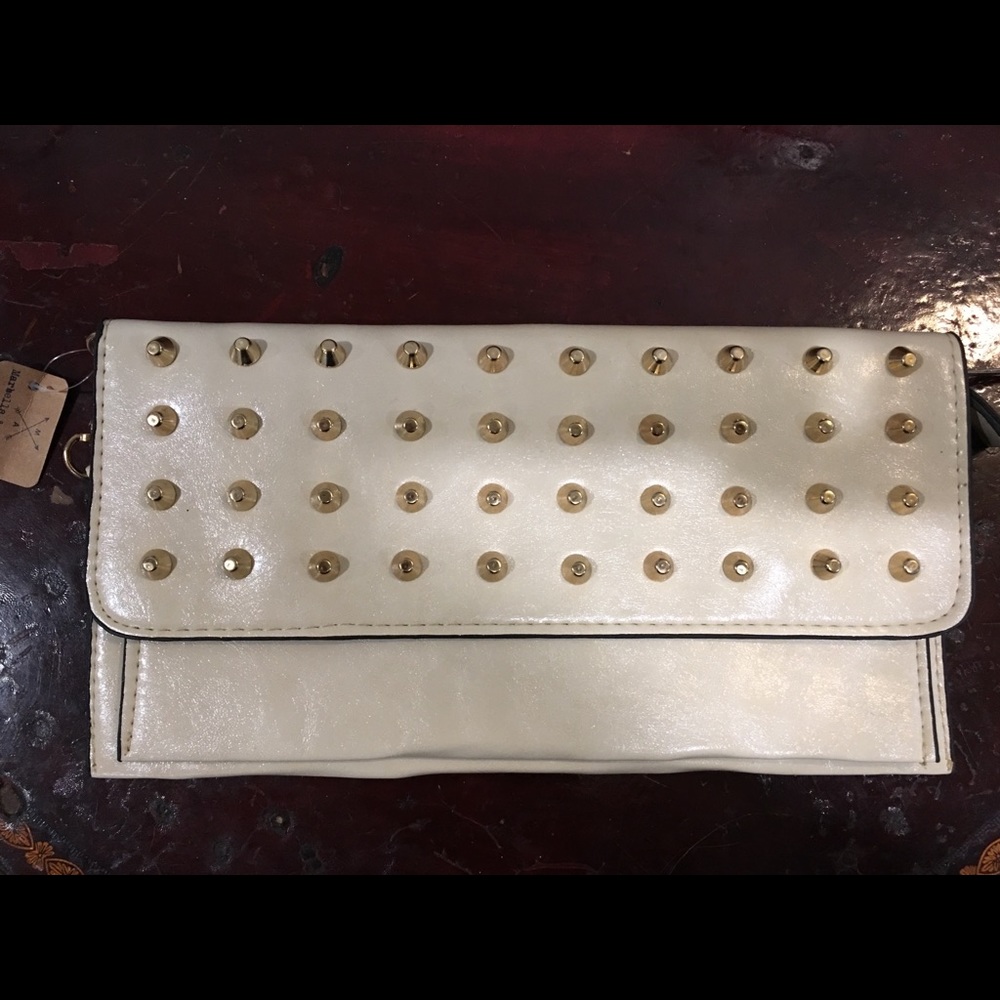 Cream colored studded clutch with gold chain